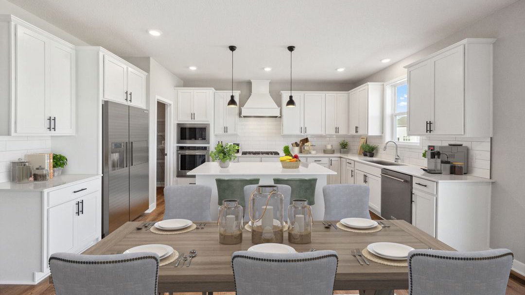 kitchen with white cabinetry, large island, and stainless steel appliances