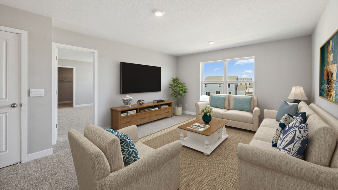 loft room with beige carpet, light grey walls and a window