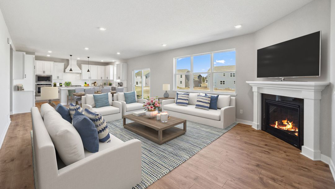 open concept first floor with the living room, dining room and kitchen next to each other