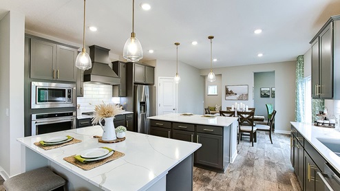 The Redwood kitchen features quartz countertops and stainless appliances.