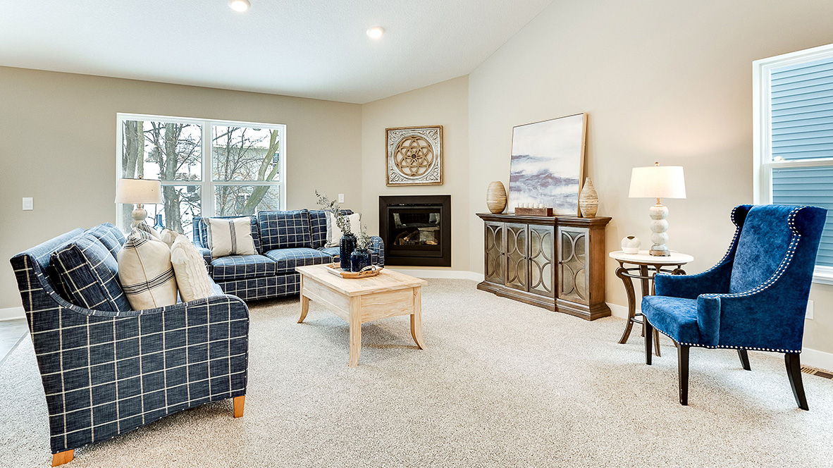 The family room with an electric fireplace.