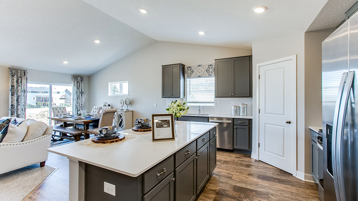 Vaulted main level ceilings over the kitchen, dinette and family room.