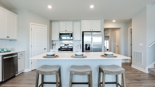 Straight on view of three-person kitchen island.