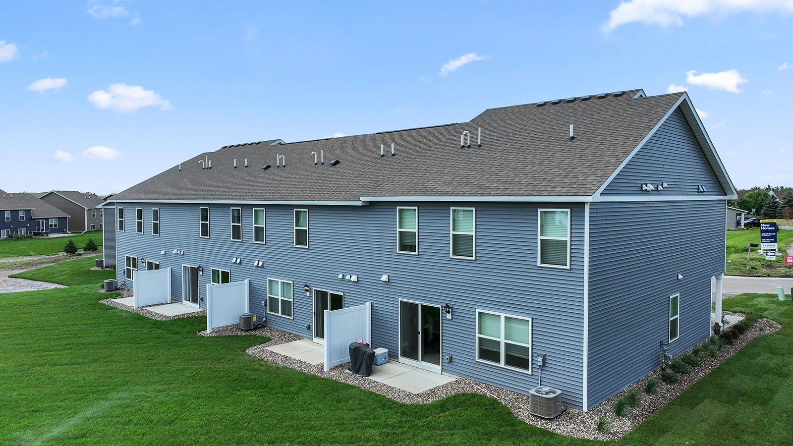 View of back of townhomes in Ardan Place