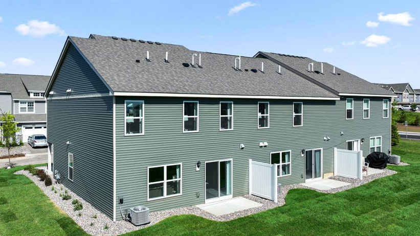 Rear exterior with patios.