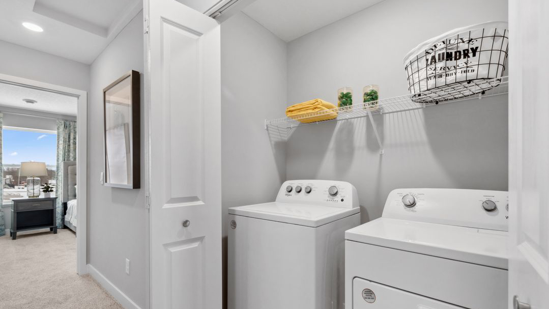 Utility laundry area with shelf