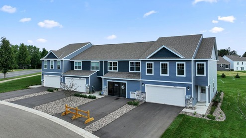 Front elevation of the townhomes and model sales center.