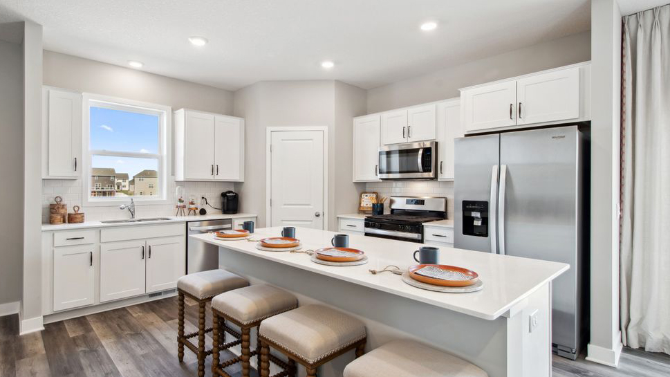 Kitchen with white cabinets and stainless steel appliances.
