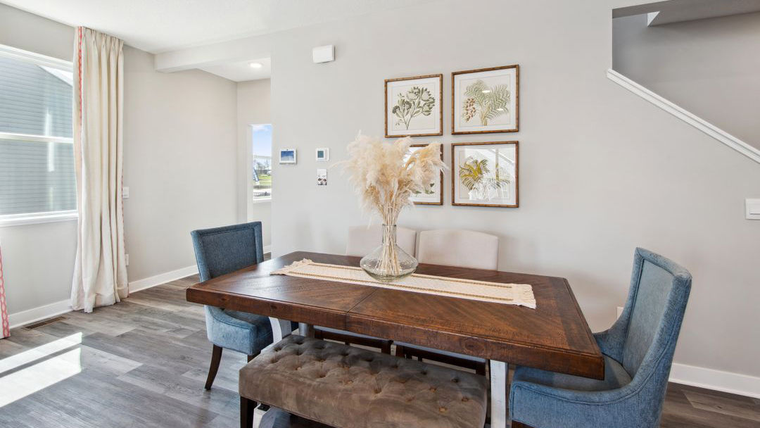 Dinette area staged with 6-person dining table and chairs.