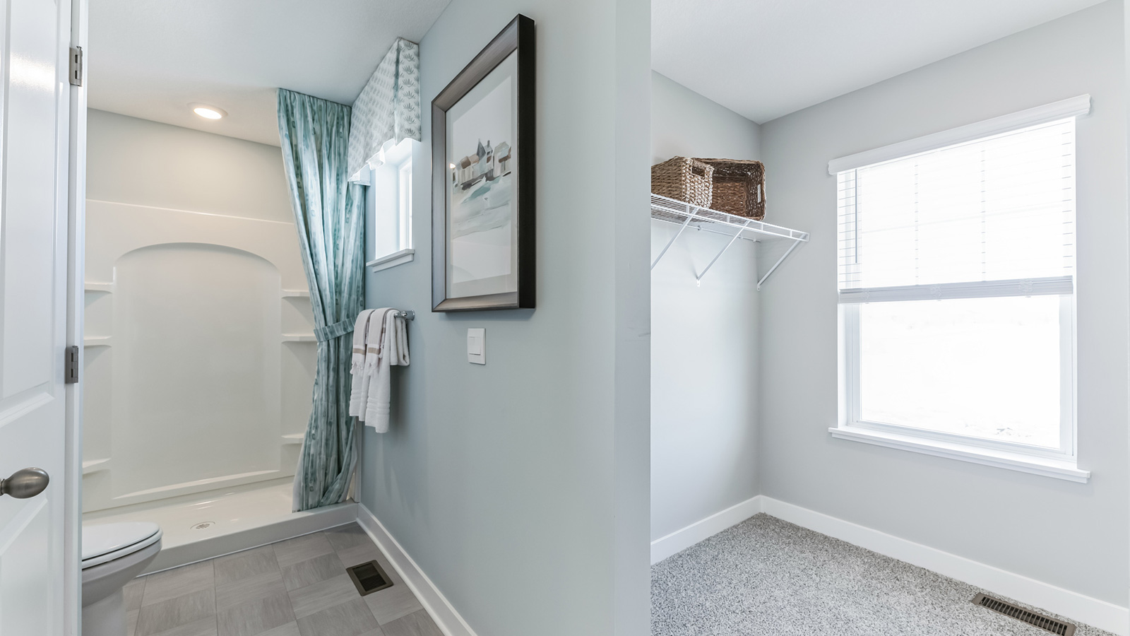 Private bathroom with white double sink vanity and quartz countertop.