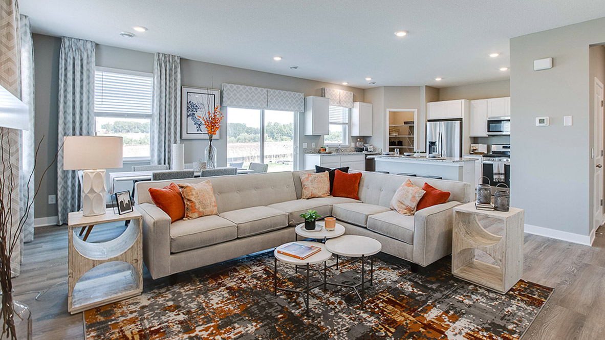 Living room with hard flooring and electric fireplace.