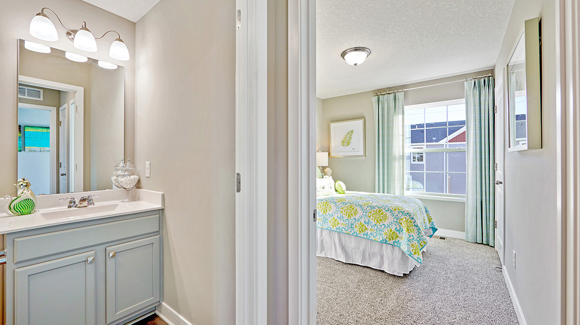 Carpeted secondary bedroom.