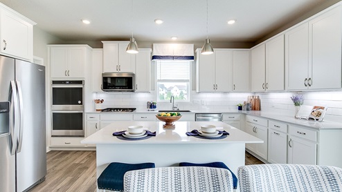 White cabinets, signature kitchen with double ovens, walk in pantry.