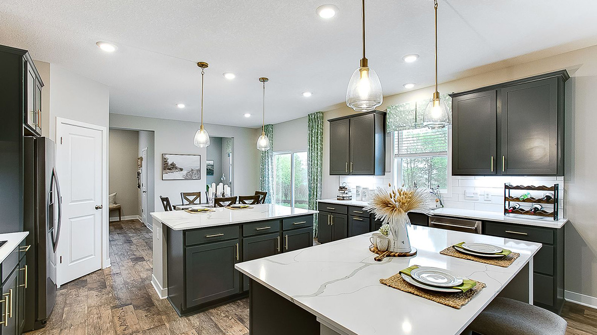Kitchen with harbor gray cabinets and dual kitchen islands.