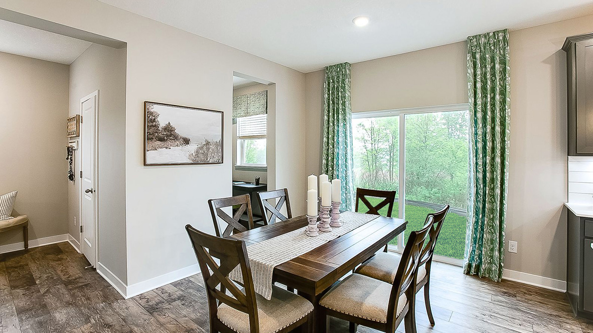 View of dinette with sliding glass doors leading outside.