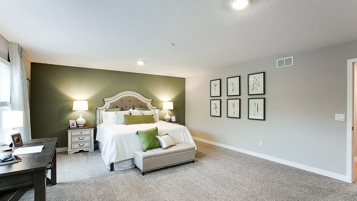 Spacious bedroom suite with private bathroom and walk-in closet.