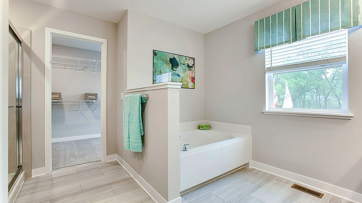Private bathroom with separate shower and soaking tub.