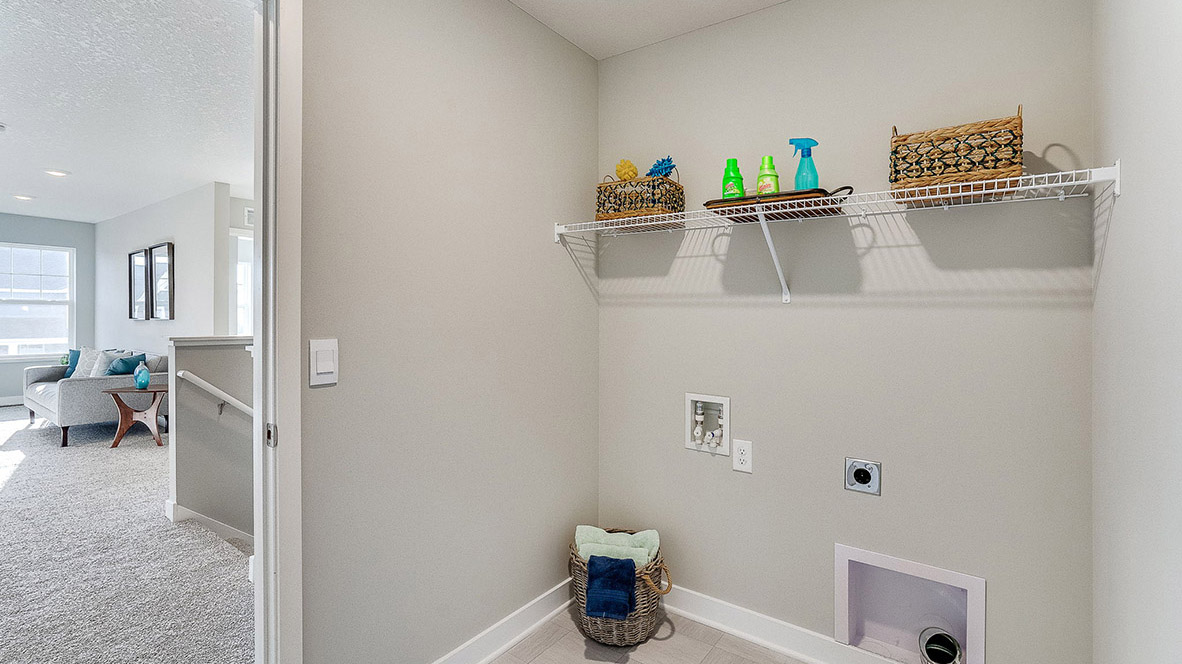 Laundry room with shelving.