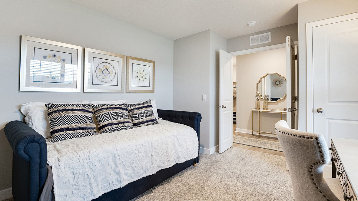 Main level bedroom with street view.