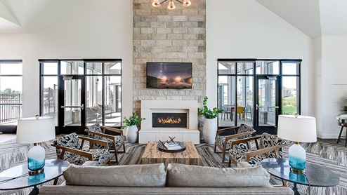 screened in porch with fireplace at the clubhouse.