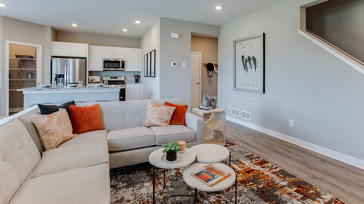 Living room with hard flooring and electric fireplace.