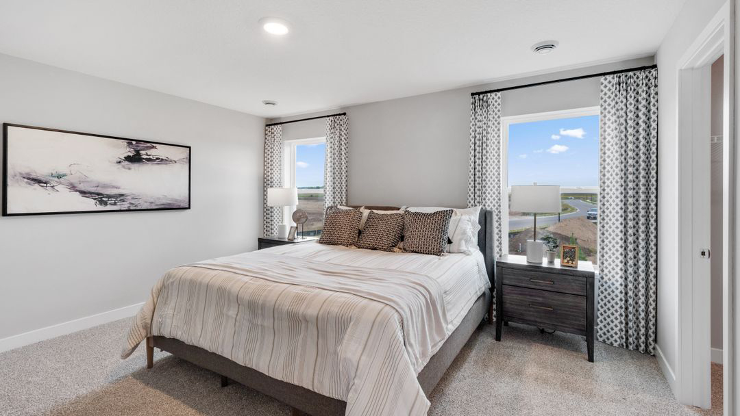 Primary bedroom with stylish direct access to spa-inspired ensuite at Brookshire By D.R. Horton