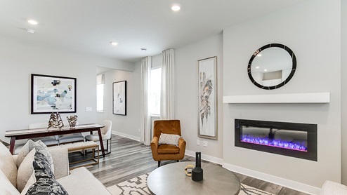 Living room and dinette areas with hard flooring.