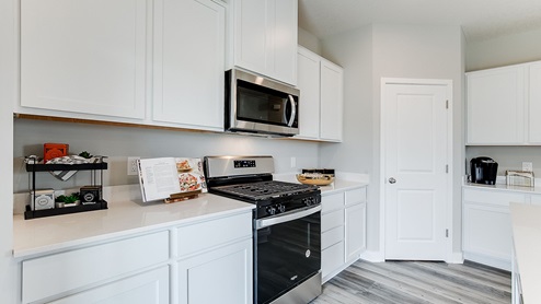 Stainless steel appliances in kitchen area.