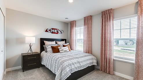 Secondary bedroom with standard closet.