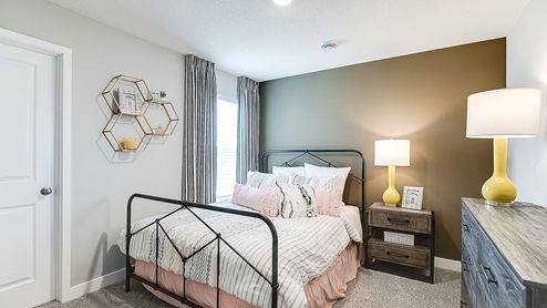 Secondary bedroom with standard closet.