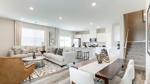 Open concept main level with living, kitchen, and dinette areas.