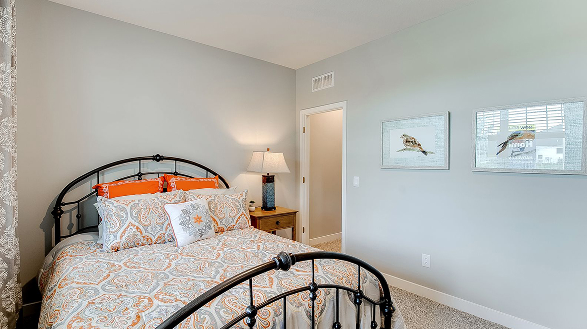 Main level bedroom with natural lighting.