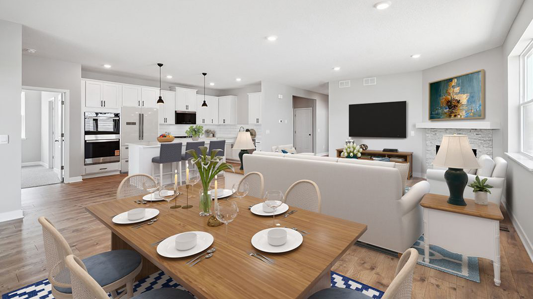 Open concept main level with view of kitchen, living room, and dinette.