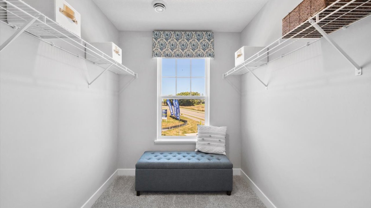 Walk in closet for the bedroom suite.