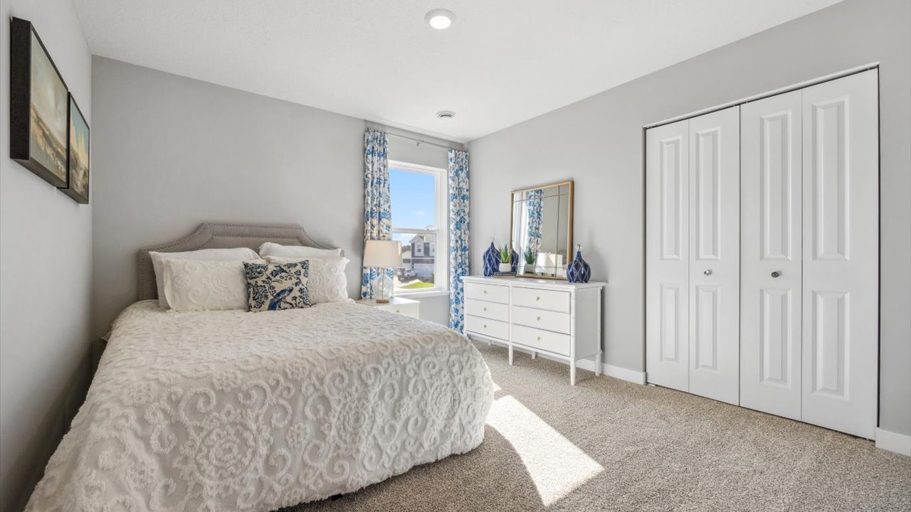 Secondary bedroom with standard closet.