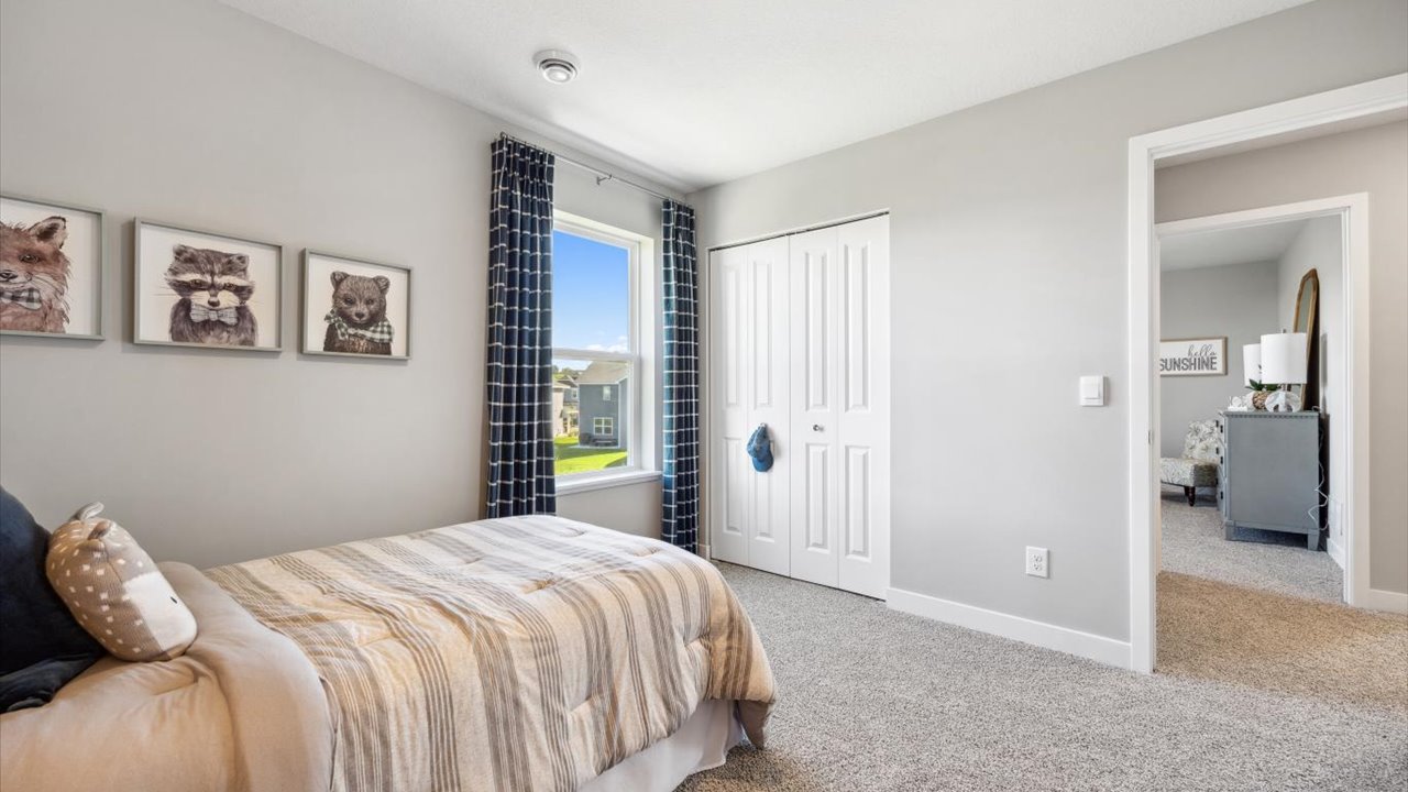 Secondary bedroom with standard closet.