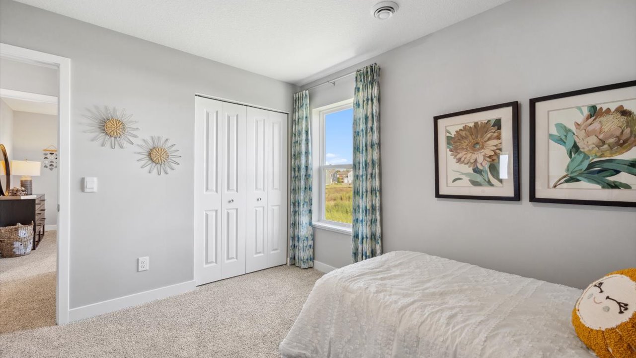 Secondary bedroom with standard closet.
