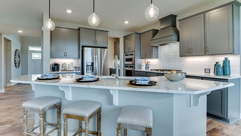 The kitchen of this Whitney plan features a butler's pantry.