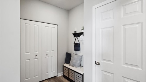 Mud room with closet for more storage.