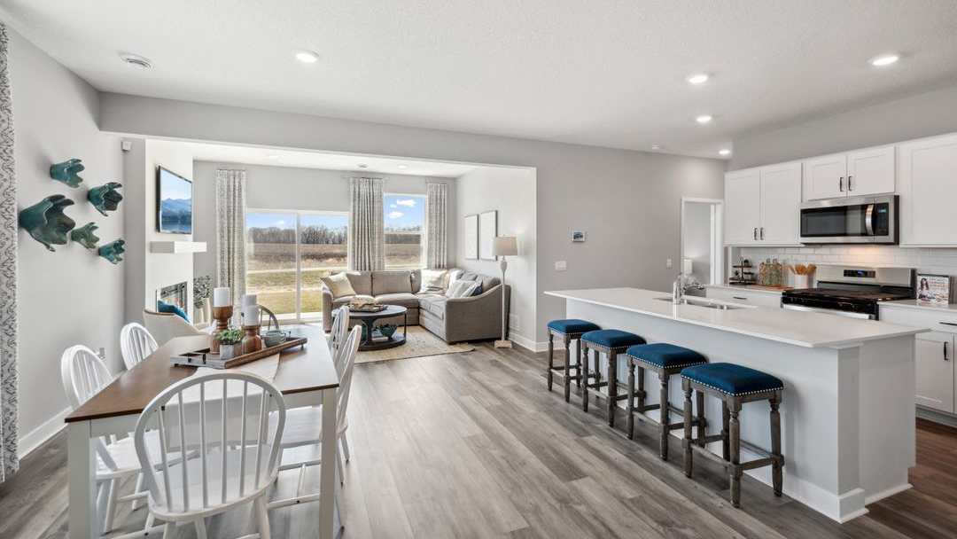 Open concept main level with view of dinette and living space.