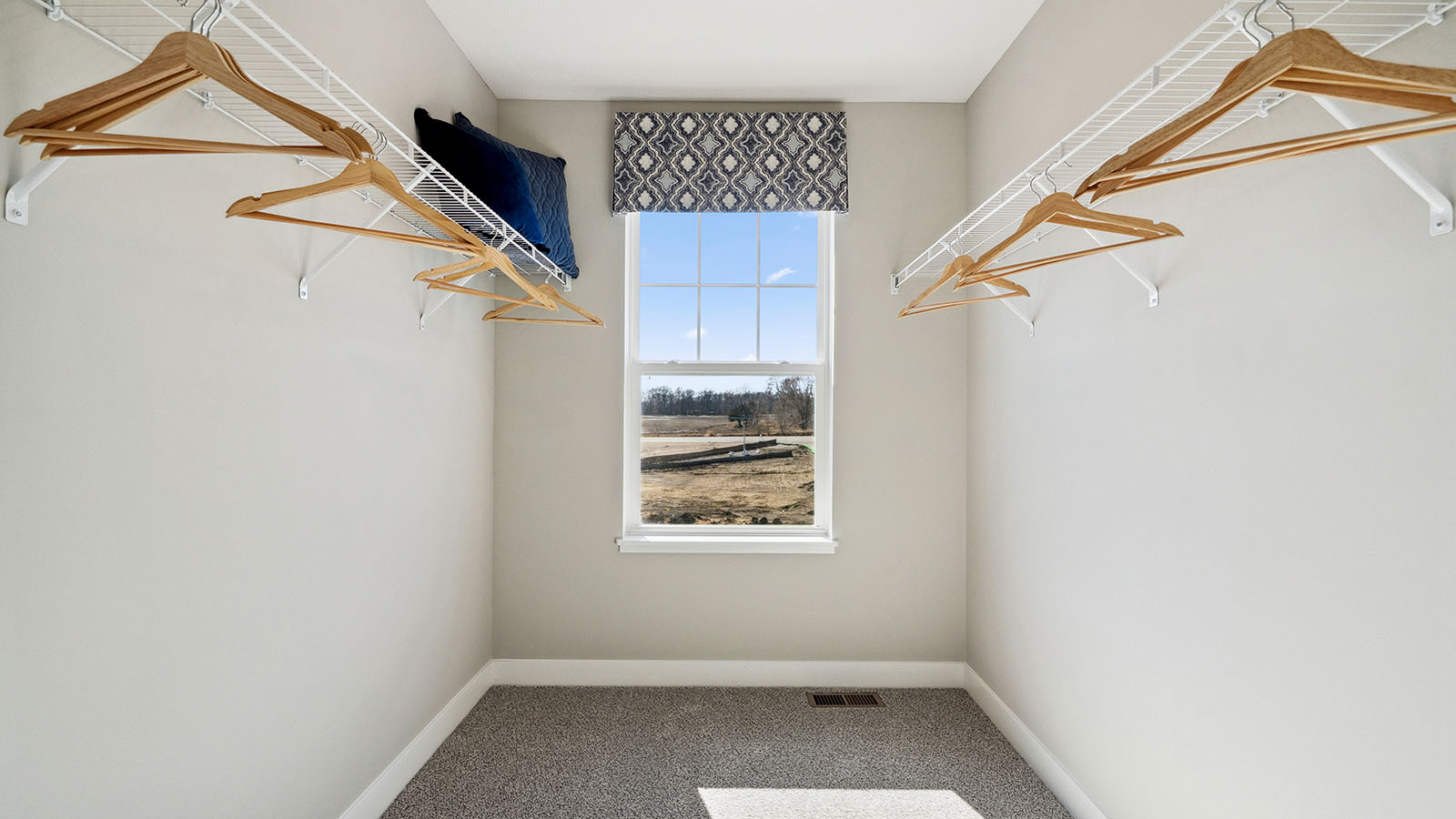Walk in closet with view of the community.