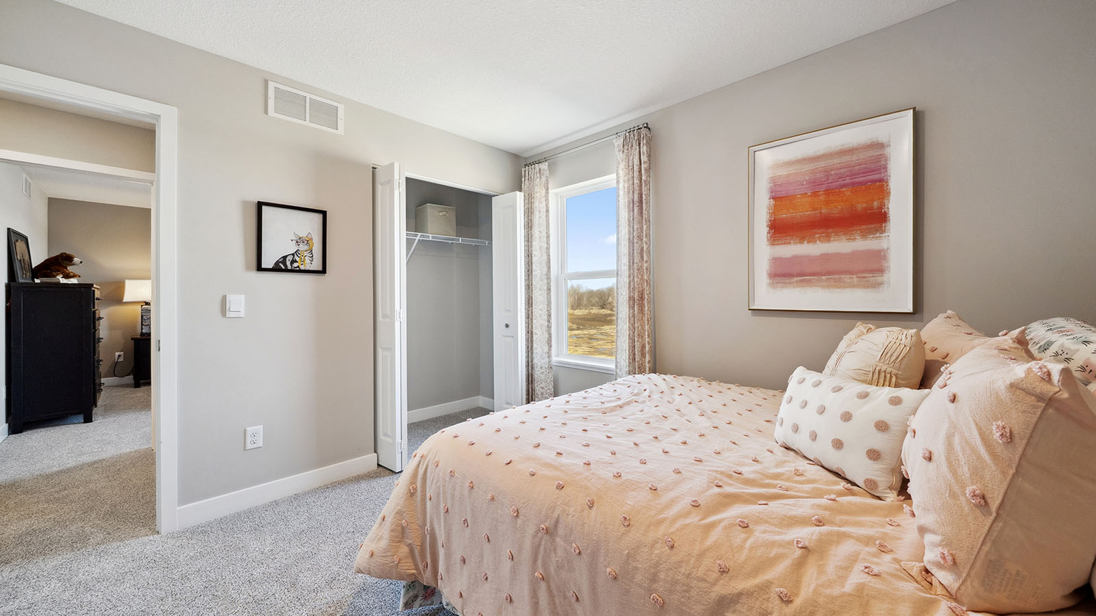Secondary bedroom with standard closet.