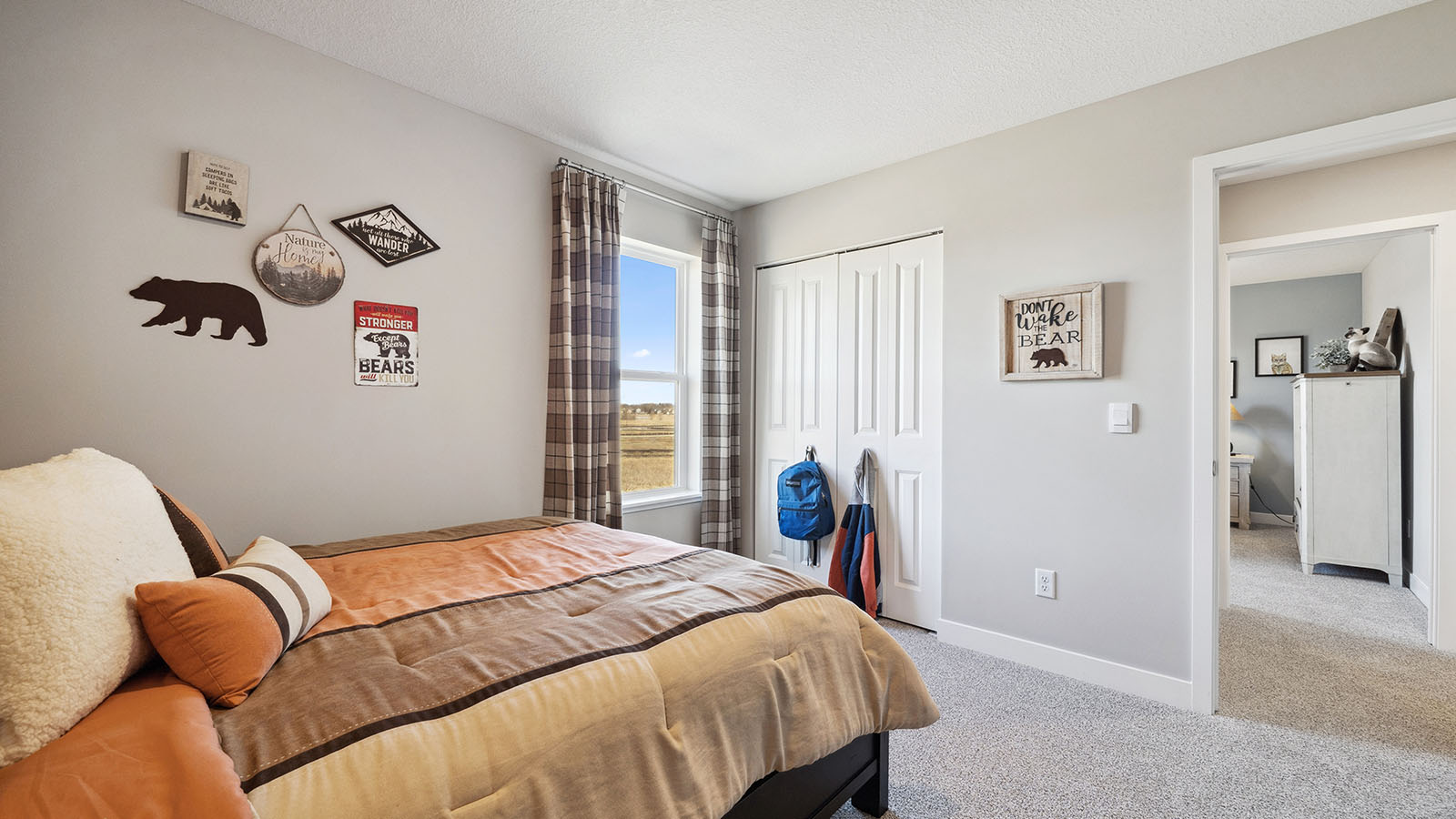 Secondary bedroom with standard closet.