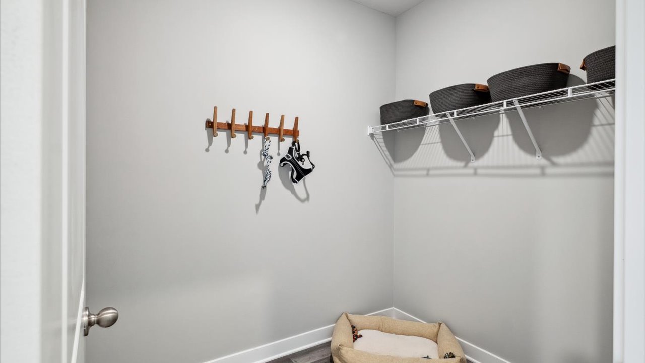 Walk-in closet adjacent to garage entrance.