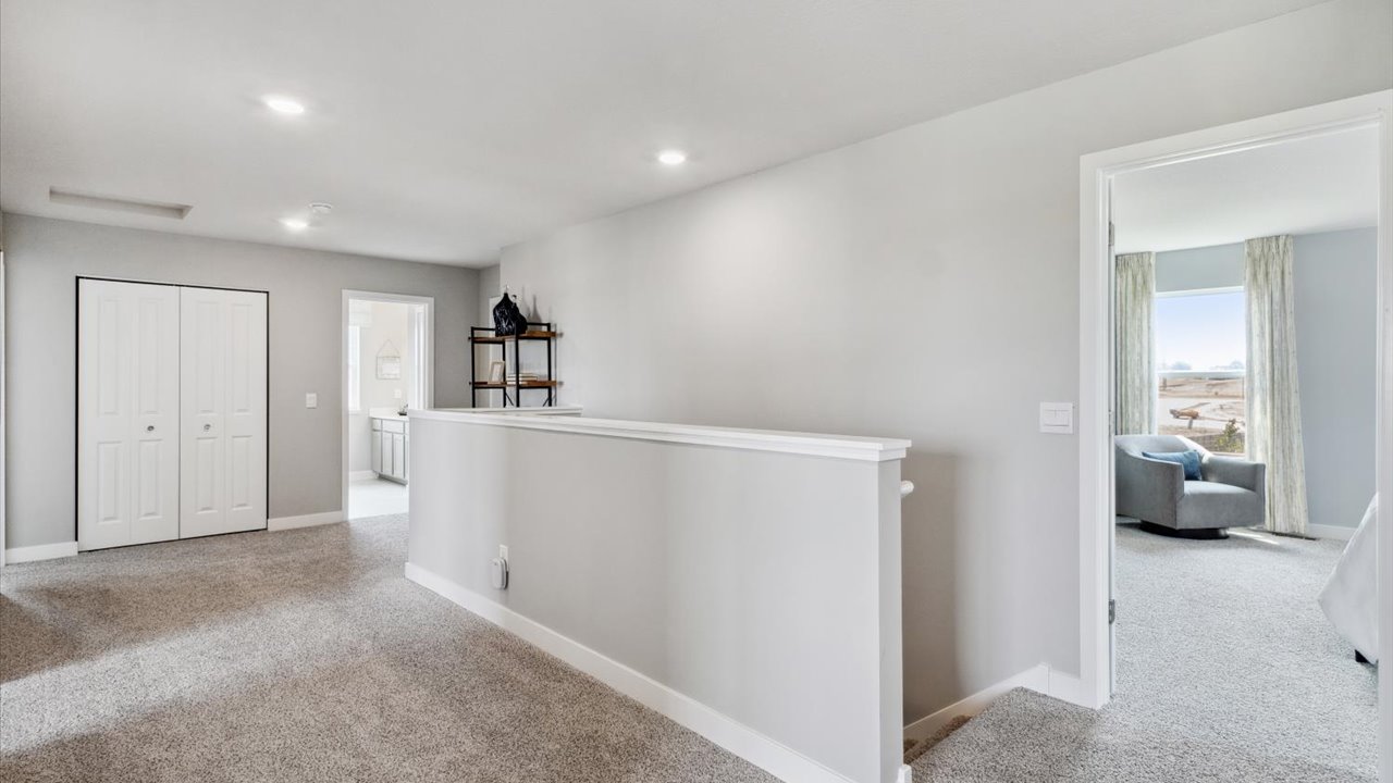 Carpeted upper level hallway.