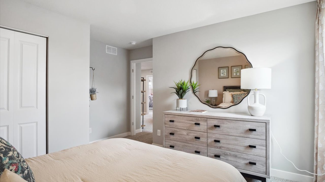 Secondary bedroom with standard closet.