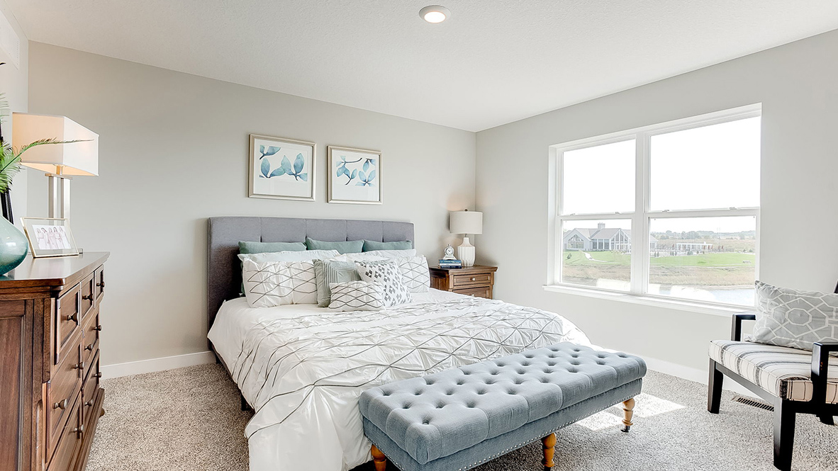 Bedroom suite with private bathroom and walk-in closet.