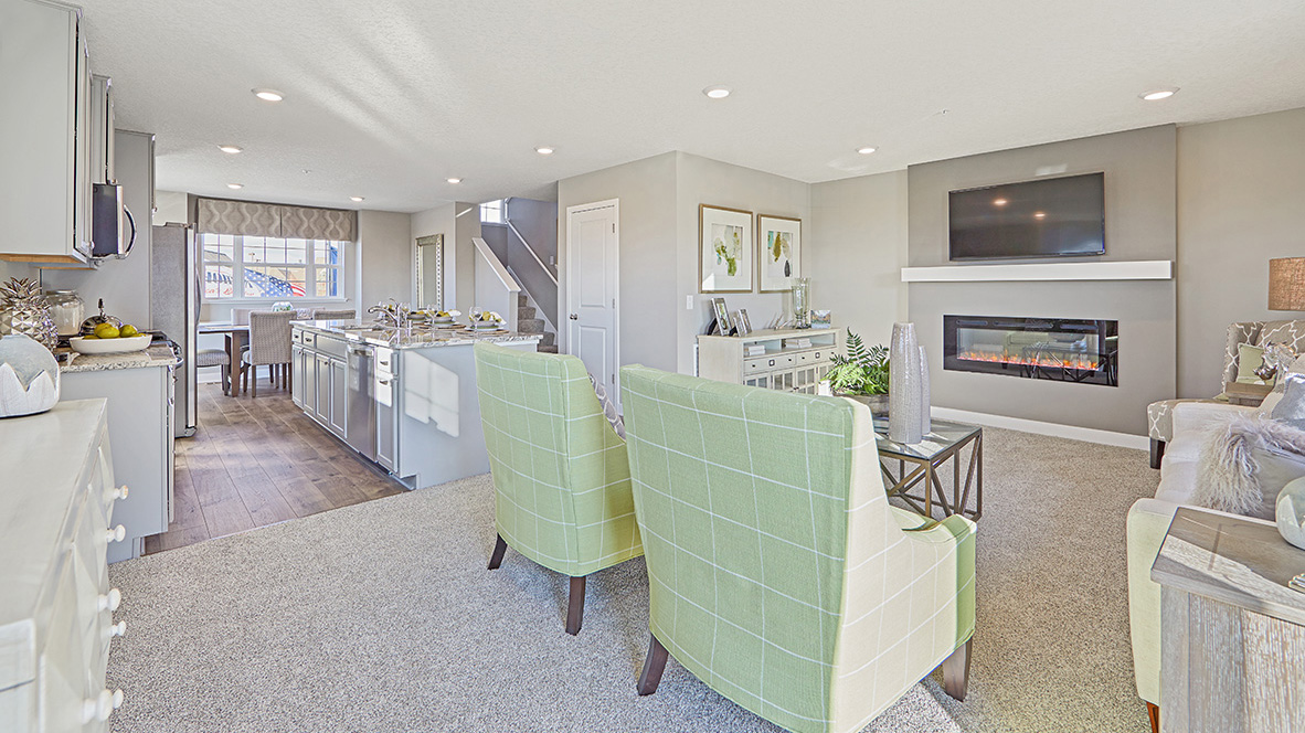 Open concept main level with view of living room, kitchen, and dinette.