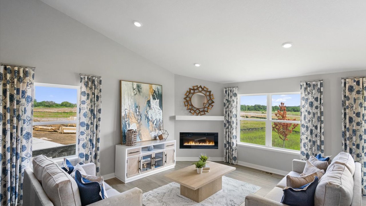 Vaulted main level family room with electric fireplace.