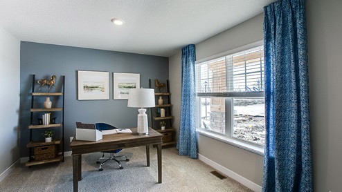Main level flex room perfect for a study or den.